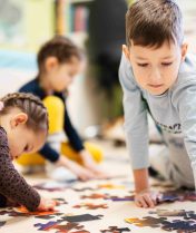 Children engaged in a floor activity