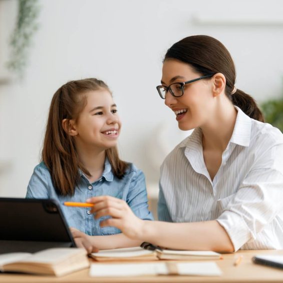 Teacher and student studying together