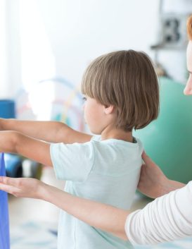 Child supported during an occupational therapy session